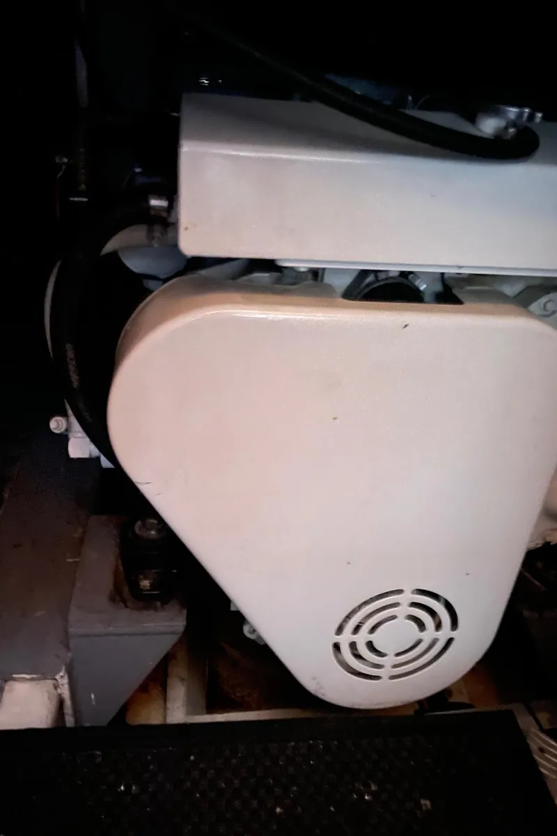 Slide: The Image of Engine compartment of a 2006 North Pacific 42 boat, featuring mechanical components. - 36