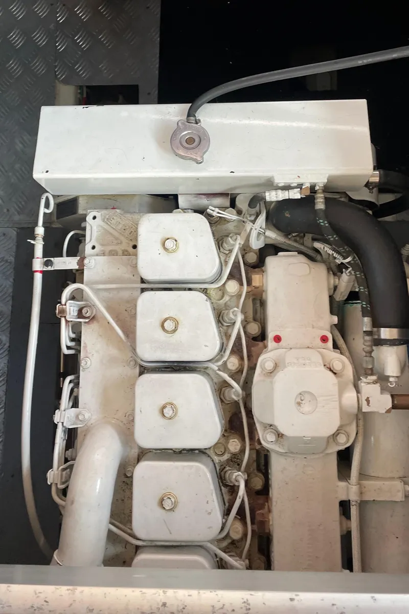 Slide: The Image of Engine compartment of a 2006 North Pacific 42 boat, showcasing mechanical components. - 37