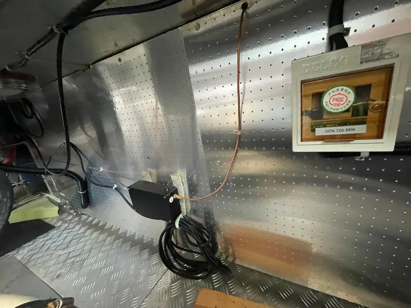 Slide: The Image of Engine room of 2006 North Pacific 42 yacht with metallic walls and wiring. - 40