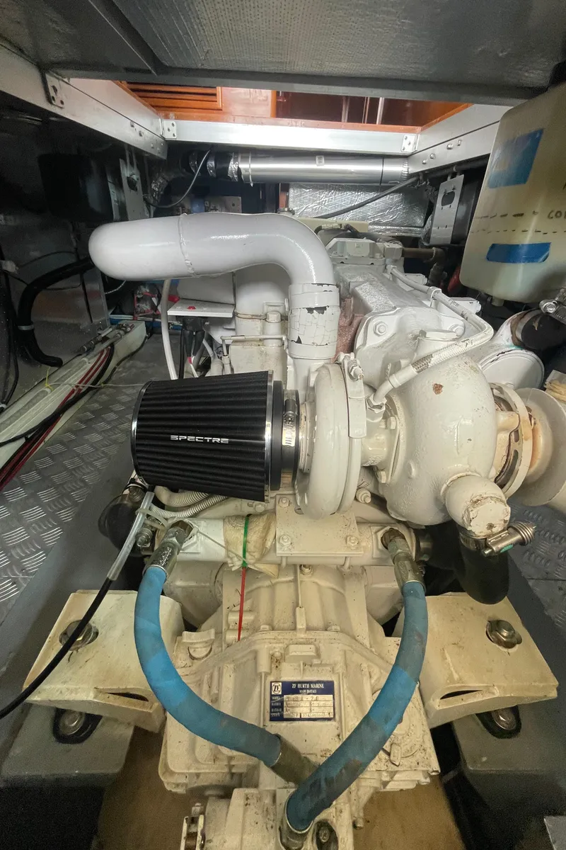 Slide: The Image of Engine room of a 2006 North Pacific 42 yacht, showcasing mechanical components and systems. - 42