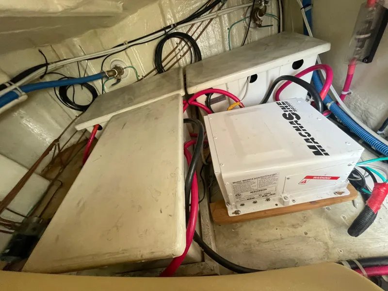 Slide: The Image of Engine room of a 2006 North Pacific 42 boat with electrical components and wiring. - 48