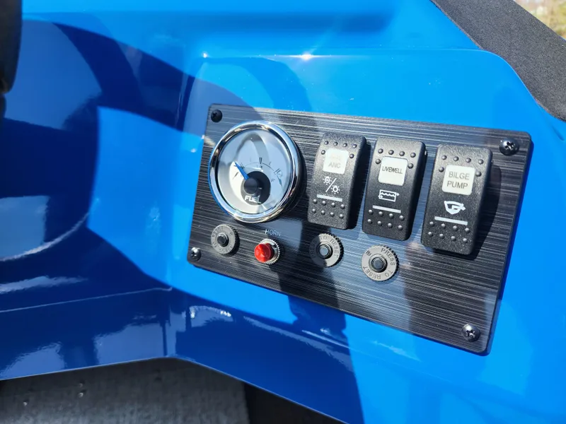 Slide: The Image of Control panel of 2025 Smoker Craft Lazer 161 boat with switches and gauge. - 11