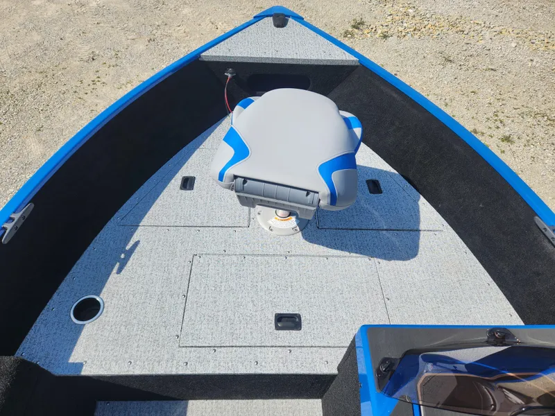 Slide: The Image of 2025 Smoker Craft Lazer 161 boat interior with gray and blue seating. - 9