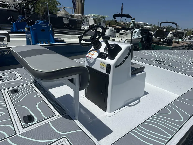 Slide: The Image of 2025 Xpress Skiff 185 boat interior with steering console and seating. - 13