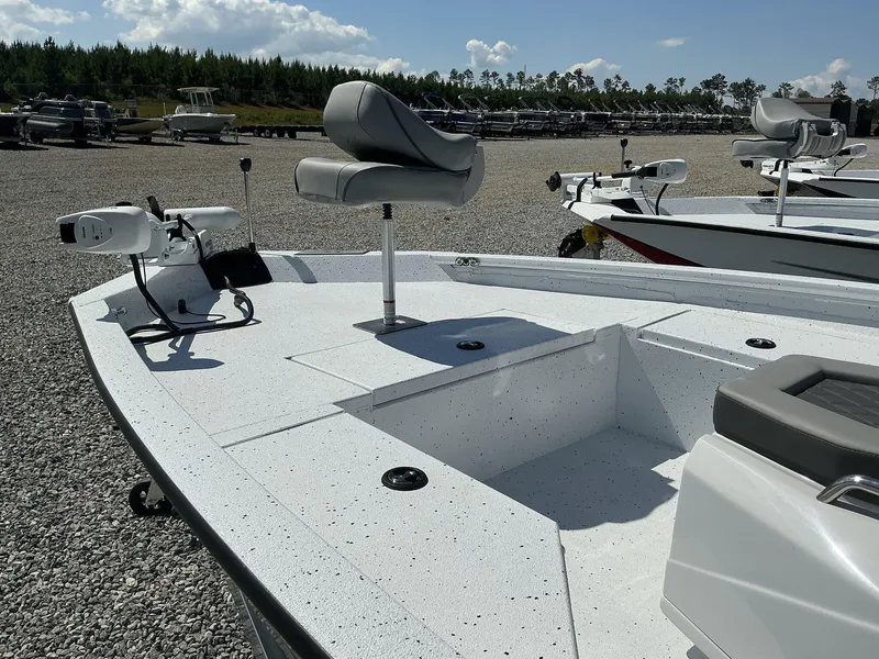 Slide: The Image of 2025 Xpress Hyper-Lift Series H20B boat with new console, parked outdoors. - 3