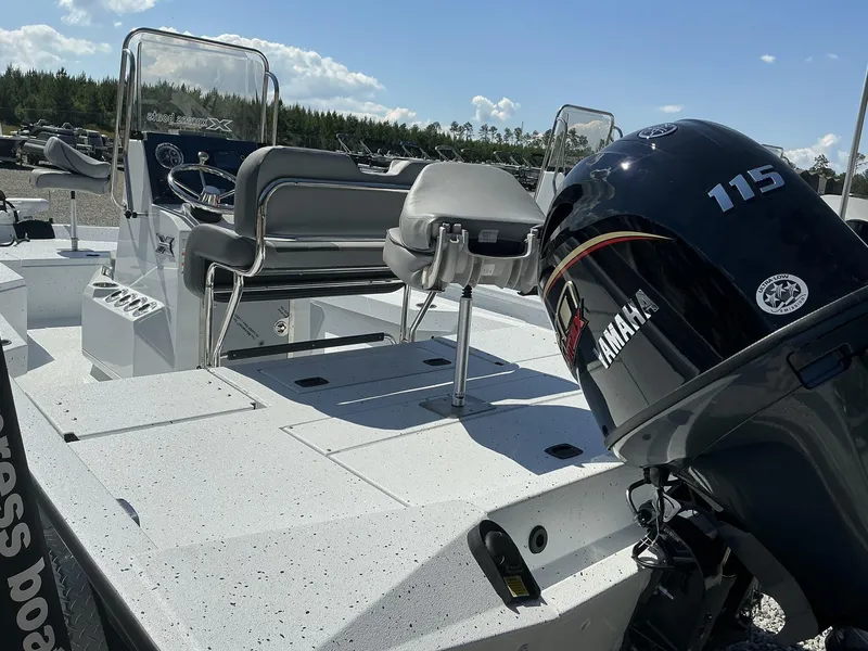 Slide: The Image of 2025 Xpress Hyper-Lift Series H20B boat with Yamaha 115 engine, featuring new console design. - 7