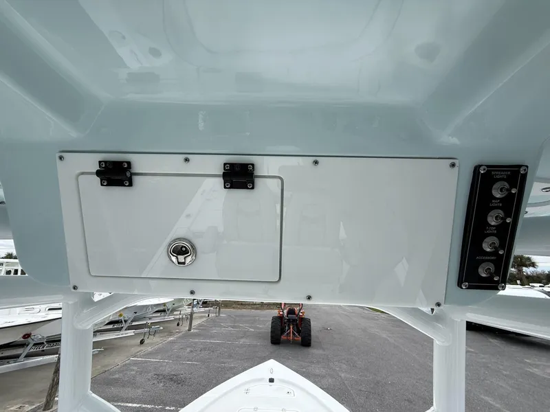 Slide: The Image of 2025 Sea Pro 230 Bay boat console with storage compartment and control panel. - 5