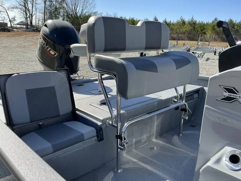 Slide: The Image of 2025 Xpress Hyper-Lift Series H20B boat interior with new console and seating. - 11