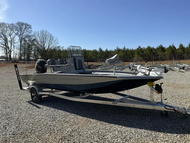 Slide: The Image of 2025 Xpress Hyper-Lift Series H20B boat on trailer, parked outdoors under clear sky. - 3