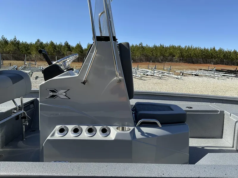 Slide: The Image of 2025 Xpress Hyper-Lift Series H20B boat console, sleek design, outdoor setting. - 6