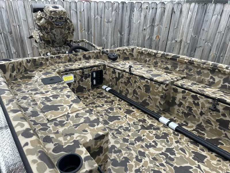 Slide: The Image of 2025 Excel Shallow Water F4 boat with camouflage paint, featuring a powerful motor. - 6