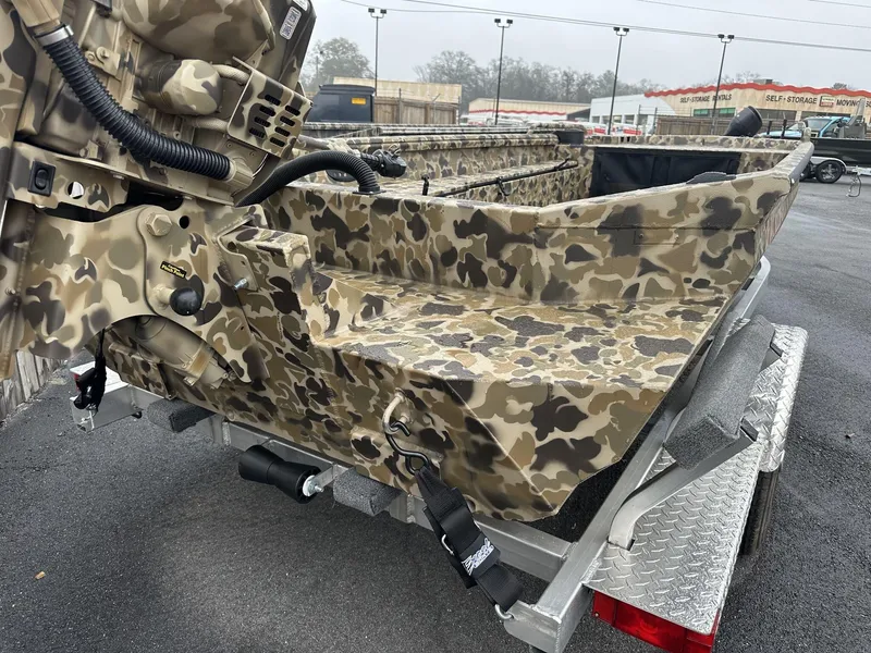 Slide: The Image of Camouflage-patterned Excel Shallow Water F4 boat on trailer, 2025 model. - 9