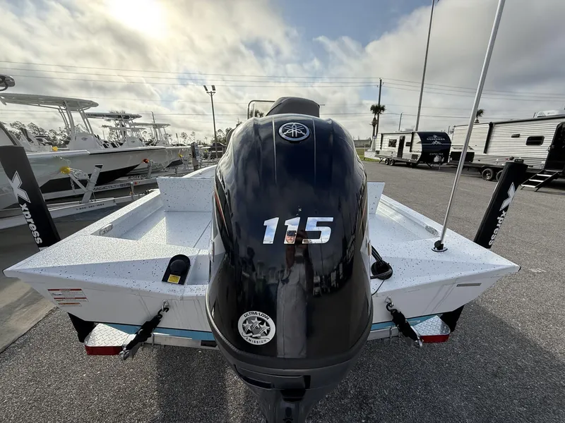 Slide: The Image of 2025 Xpress Hyper-Lift Series H20B boat with 115 horsepower engine, parked outdoors. - 3