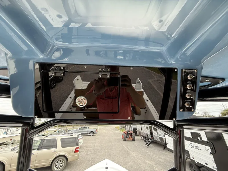 Slide: The Image of 2025 Sea Pro 230 Bay boat dashboard with control panel and switches. - 7