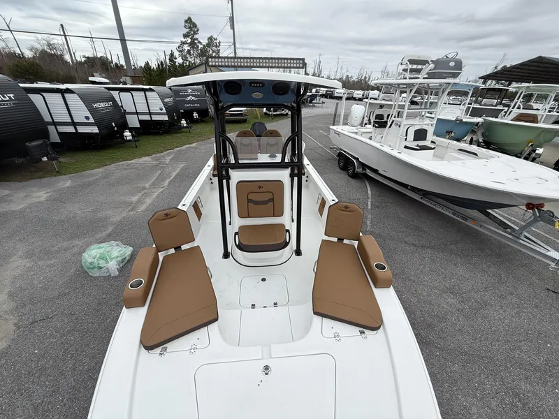 Slide: The Image of 2025 Sea Pro 230 Bay boat with tan seating, parked on a lot. - 9
