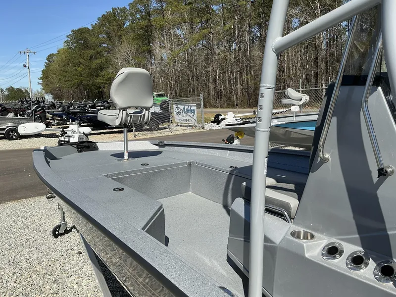 Slide: The Image of 2025 Xpress Hyper-Lift Series H22B boat with Terrova, stereo, and seating, displayed outdoors. - 10