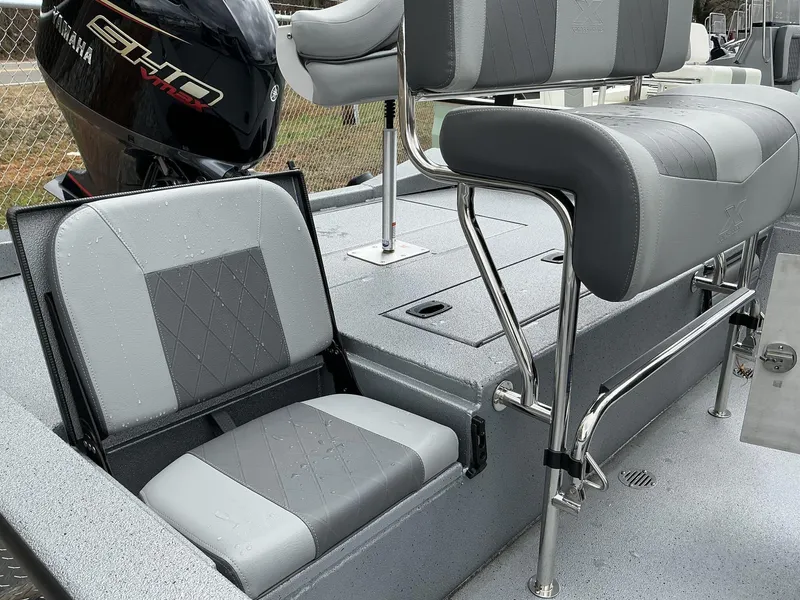 Slide: The Image of 2025 Xpress Hyper-Lift H22B boat interior with Yamaha engine, featuring gray seating and chrome details. - 3