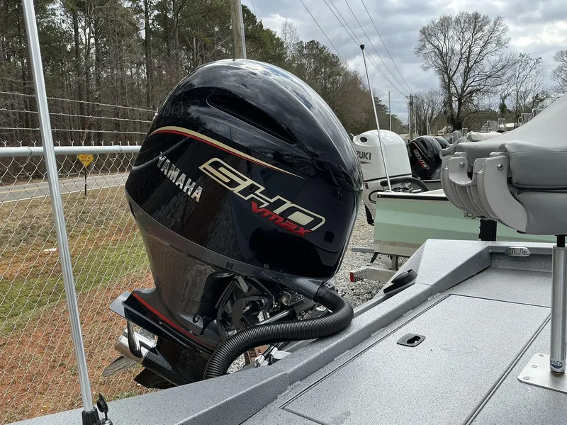 Slide: The Image of 2025 Xpress Hyper-Lift H22B boat with Yamaha SHO VMAX engine, parked outdoors. - 5