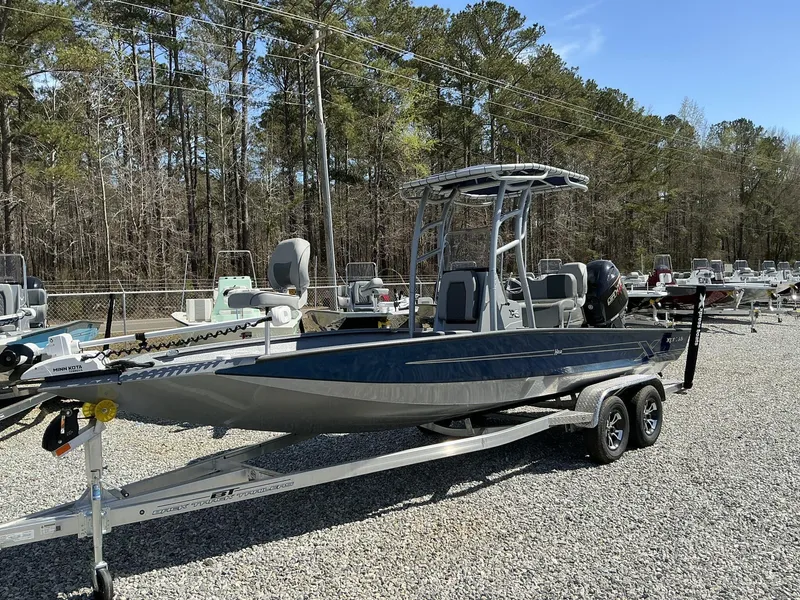 Slide: The Image of 2025 Xpress Hyper-Lift Series H22B boat with Terrova and stereo, parked on a trailer. - 8