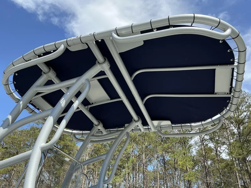 Slide: The Image of Aluminum frame and canopy of 2025 Xpress Hyper-Lift Series H22B boat against blue sky. - 9