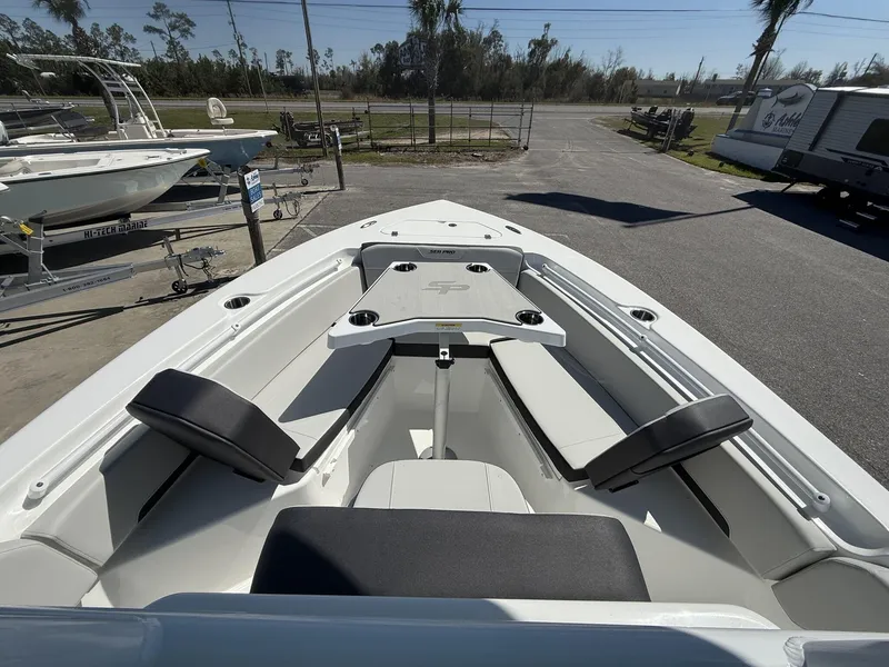Slide: The Image of 2025 Sea Pro 225FLX SANDBAR boat interior with seating and cup holders. - 13