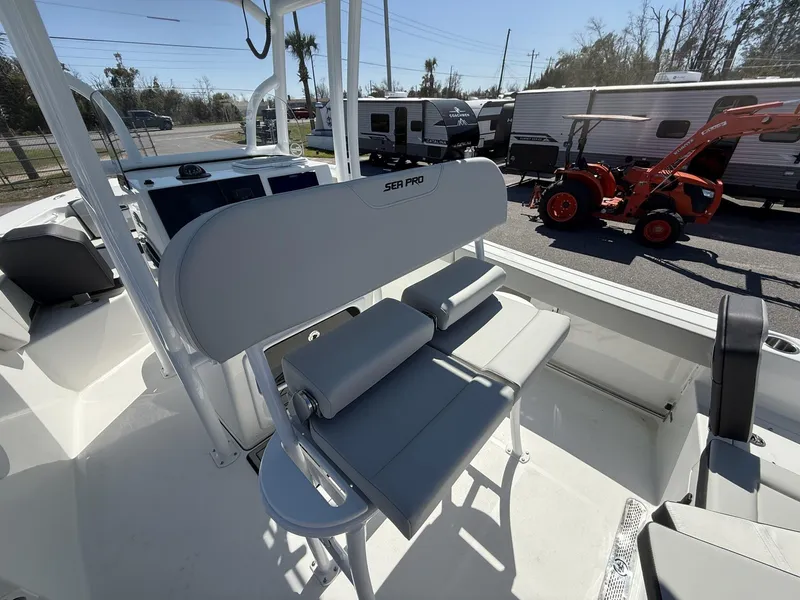Slide: The Image of 2025 Sea Pro 225FLX SANDBAR boat interior with seating and console. - 15