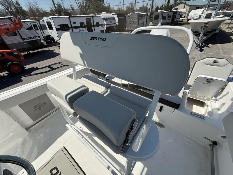 Slide: The Image of 2025 Sea Pro 225FLX SANDBAR boat interior with seating and storage compartments. - 9