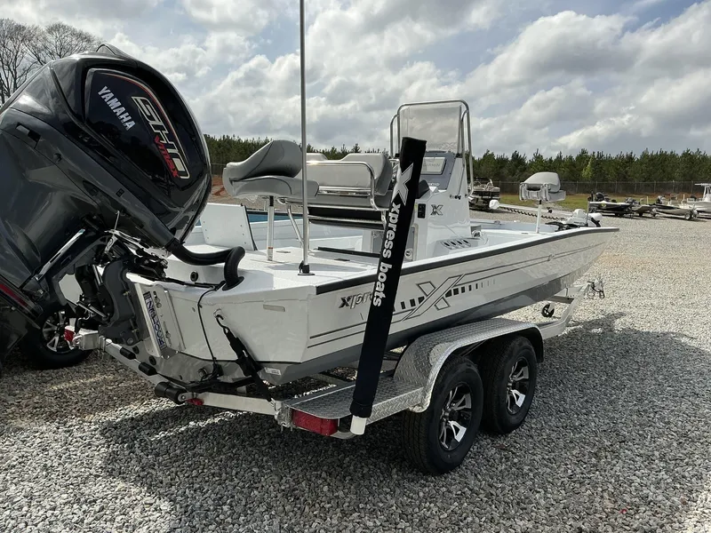 Slide: The Image of 2025 Xpress Hyper-Lift Series H22B boat on trailer, featuring Yamaha engine. - 3