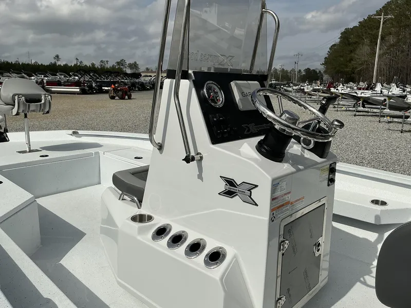 Slide: The Image of 2025 Xpress Hyper-Lift Series H22B boat console with steering wheel and controls. - 6