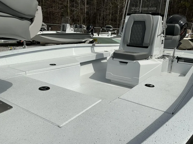 Slide: The Image of 2025 Xpress Hyper-Lift Series H22B boat interior with seating and storage compartments. - 8