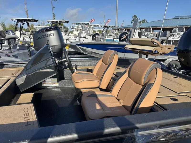 Slide: The Image of 2025 Xpress Hyper-Lift Series H18 Crappie Model boat with Suzuki engine and tan seats. - 8