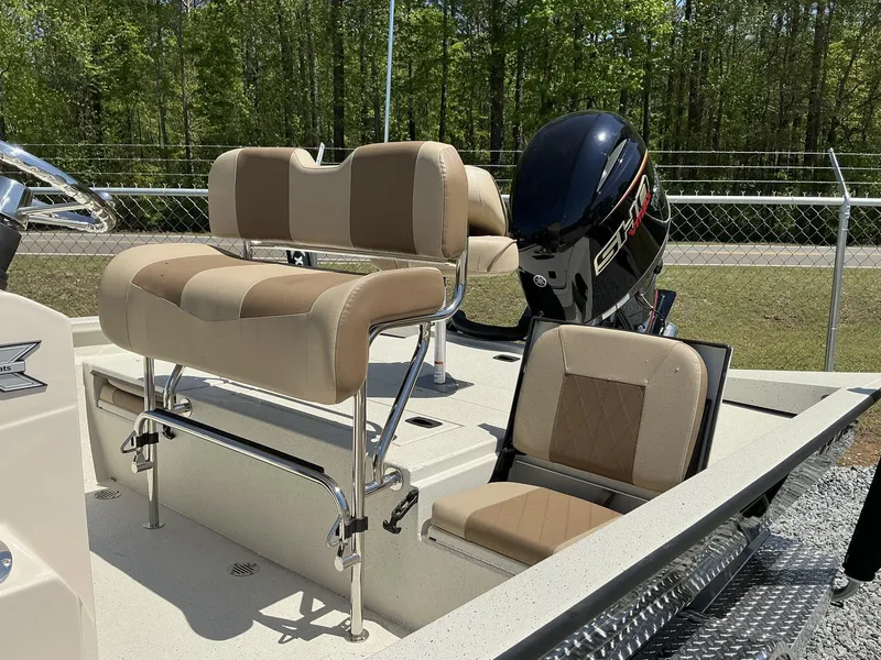 Slide: The Image of 2025 Xpress Hyper-Lift Series H22B boat with Terrova motor and stereo, featuring beige seating. - 9