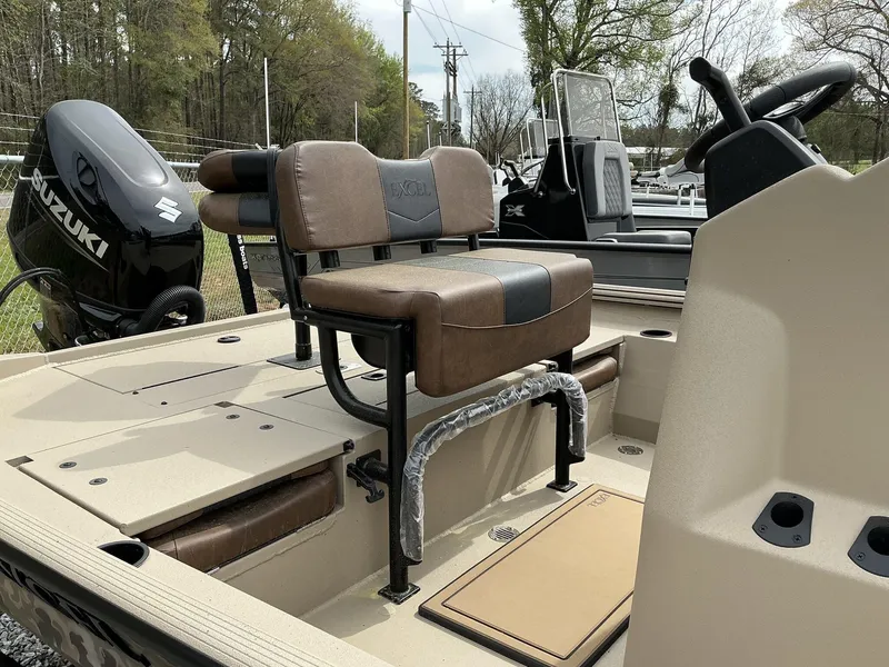 Slide: The Image of 2025 Excel Bay Pro 203 ELITE boat interior with Suzuki engine and cushioned seating. - 10