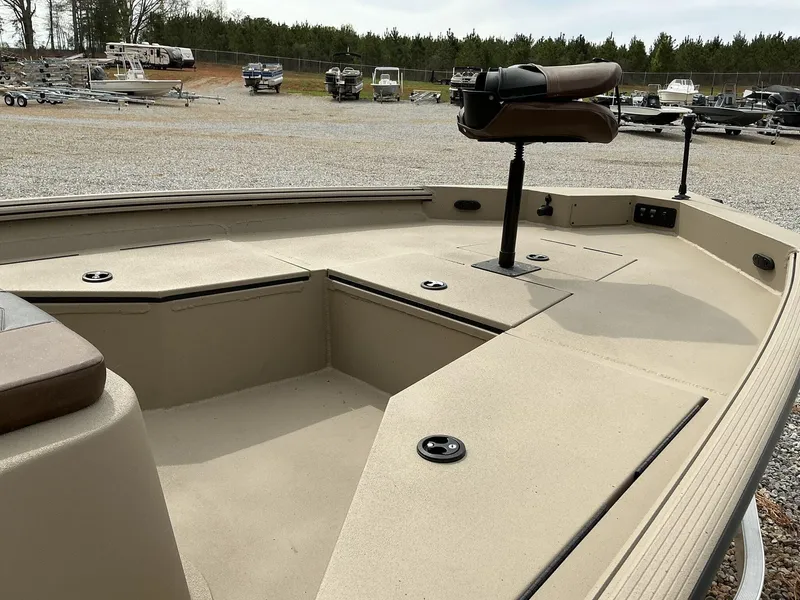 Slide: The Image of 2025 Excel Bay Pro 203 ELITE boat interior with seating and storage compartments. - 4