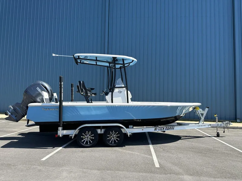 Slide: The Image of 2025 Tidewater 2110 Bay Max boat on trailer, parked outdoors. - 3
