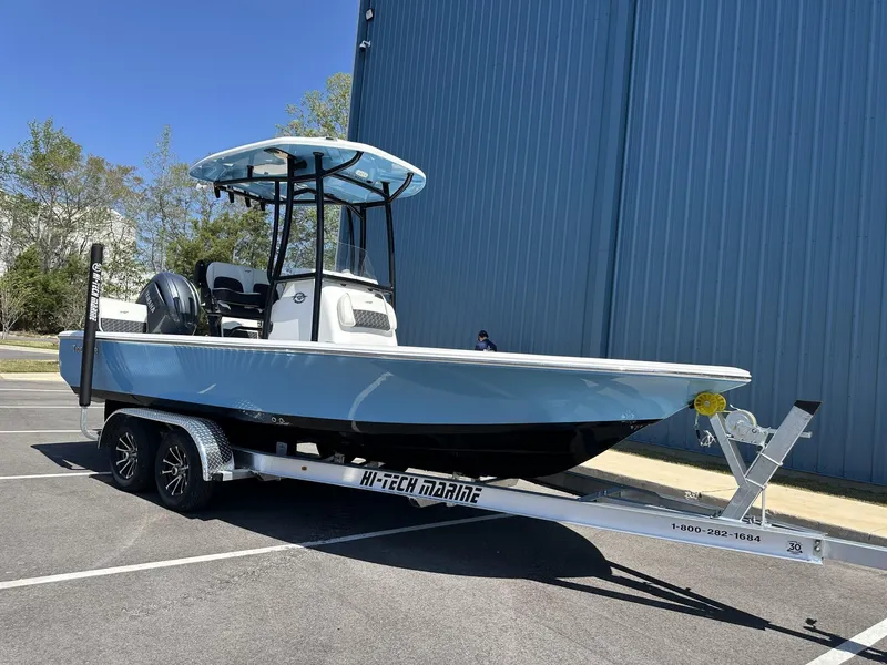 Slide: The Image of 2025 Tidewater 2110 Bay Max boat on trailer, parked outdoors. - 6
