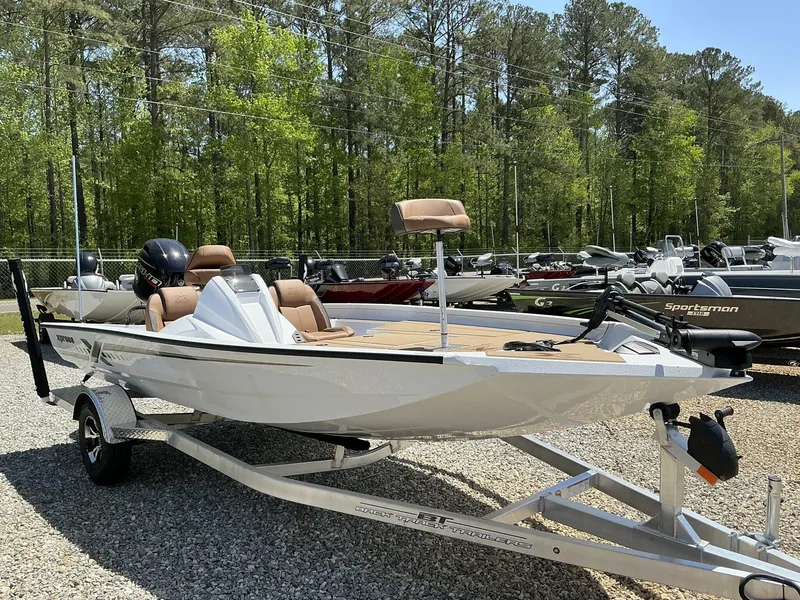 Slide: The Image of 2025 Xpress Hyper-Lift Series H18 bass boat on trailer, parked outdoors. - 1