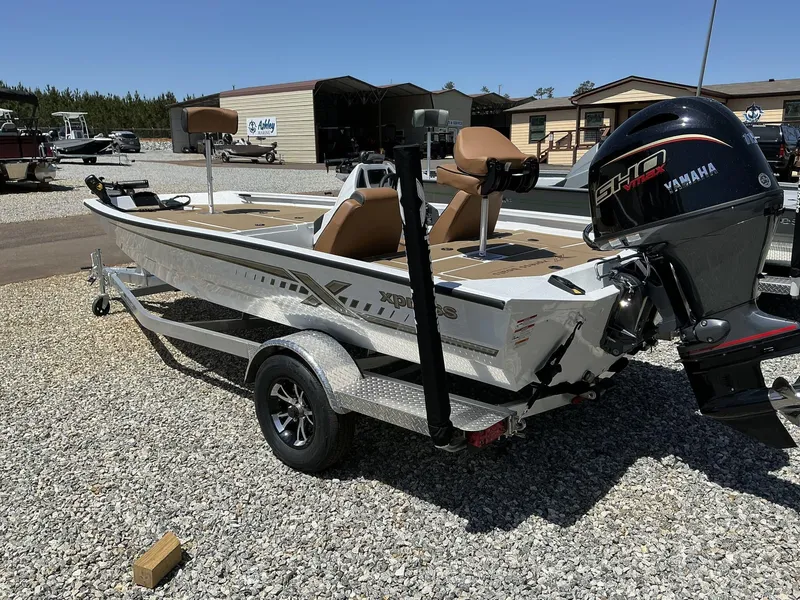 Slide: The Image of 2025 Xpress Hyper-Lift Series H18 bass boat with Yamaha engine on trailer. - 7