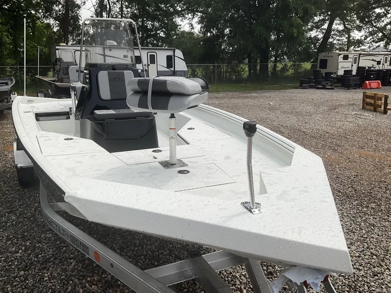 Slide: The Image of 2025 Excel Bay Pro 203 Elite boat on trailer in outdoor setting. - 3