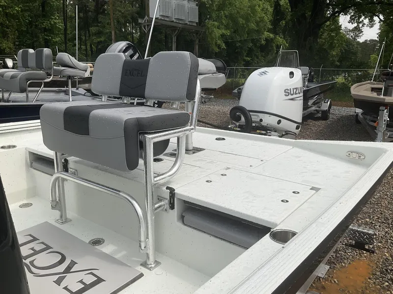 Slide: The Image of 2025 Excel Bay Pro 203 ELITE boat with Suzuki outboard motor, featuring comfortable seating. - 6