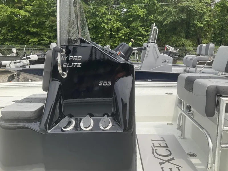 Slide: The Image of 2025 Excel Bay Pro 203 Elite boat interior with sleek black console and seating. - 8