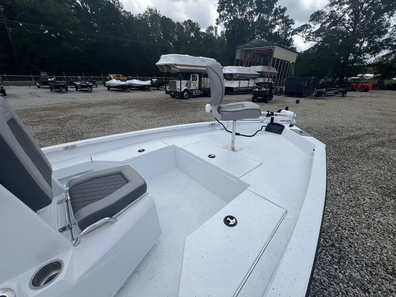 Slide: The Image of 2025 Xpress Hyper-Lift Series H20B boat with new console, parked outdoors. - 4