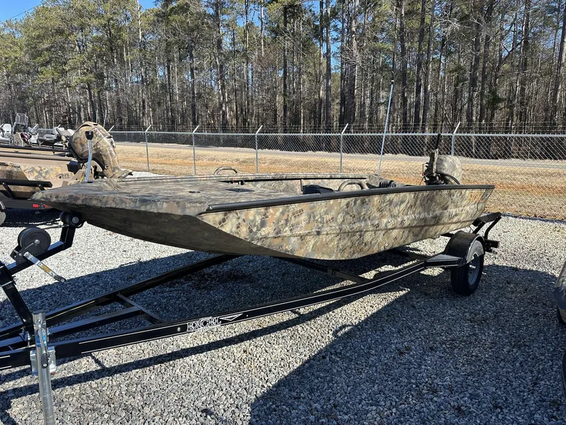 Slide: The Image of 2025 Excel Viper F4 1754 ECLIPSE boat on trailer, camo design, parked outdoors. - 1