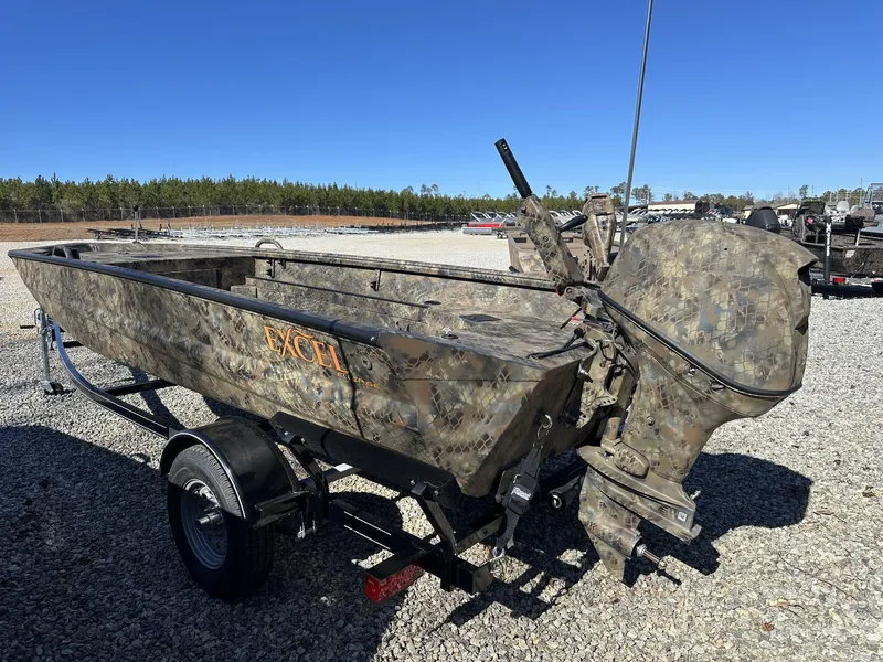 Slide: The Image of 2025 Excel Viper F4 1754 ECLIPSE boat with camouflage design on gravel lot. - 2