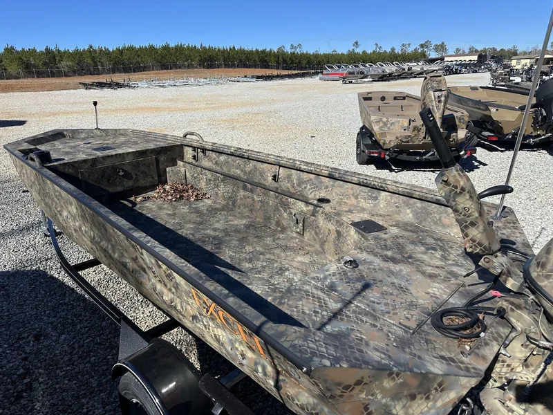 Slide: The Image of 2025 Excel Viper F4 1754 ECLIPSE boat with camouflage design on gravel lot. - 3