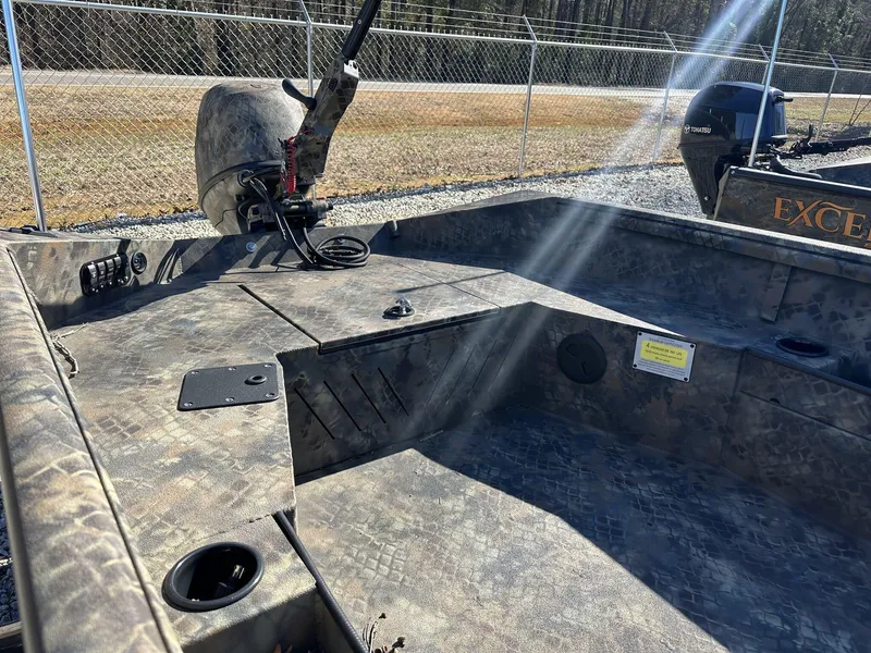 Slide: The Image of 2025 Excel Viper F4 1754 ECLIPSE boat interior with camouflage design and motor. - 5