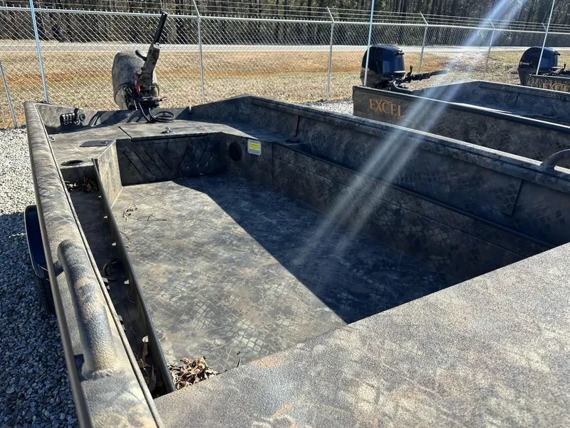 Slide: The Image of 2025 Excel Viper F4 1754 ECLIPSE boat with camouflage design in a fenced area. - 6