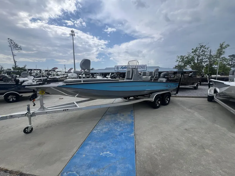 Slide: The Image of 2025 Xpress Hyper-Lift Series H22B boat on trailer under cloudy sky. - 3