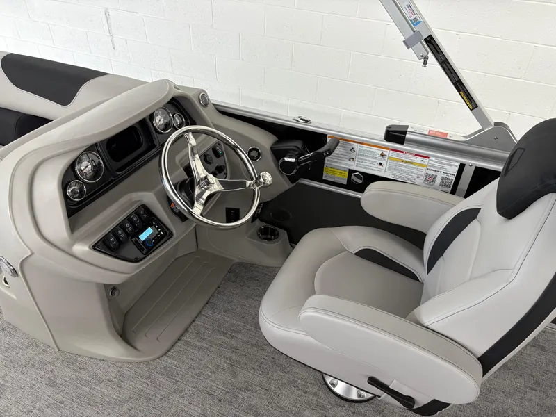 Slide: The Image of 2025 South Bay 222FCR boat interior with modern steering console and comfortable seating. - 10