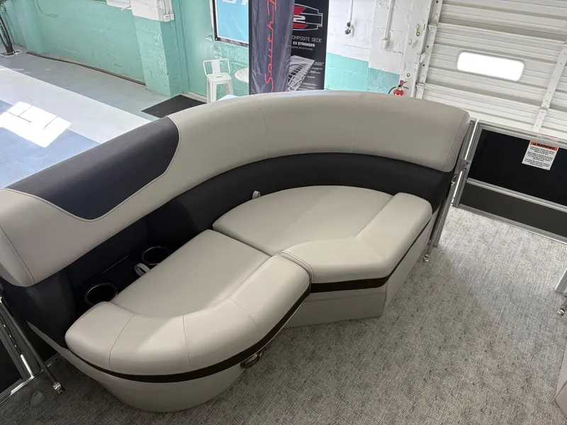 Slide: The Image of 2025 South Bay 222FCR boat interior with curved seating and cup holders. - 12